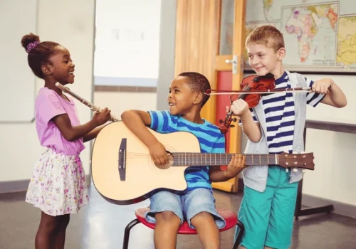 smiling-kids-playing-guitar-violin-600nw-447165223